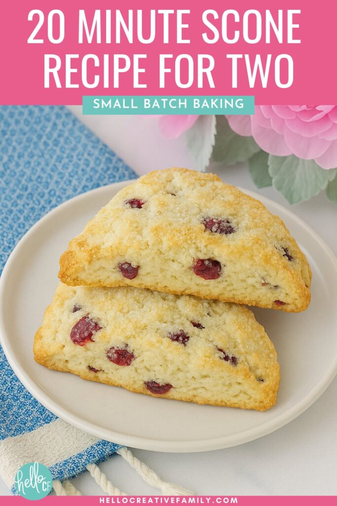 Two scones sitting on a white plate with a blue towel and pink flowers. 20 Minute Start To Finish Scone Recipe for Two... or One