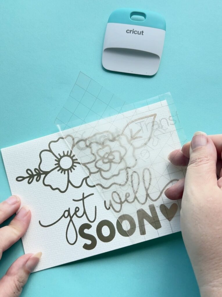 When you have finished weeding, apply your transfer tape covered design as you usually would. Burnish it with your scraper and remove the transfer tape leaving your vinyl decal on the surface you are applying it to.