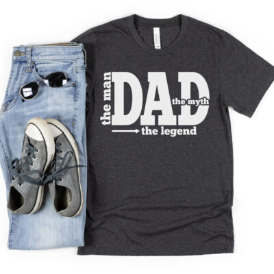 Dad The Man The Myth The Legend SVG From Hello Creative Family on a grey shirt with jeans and converse.
