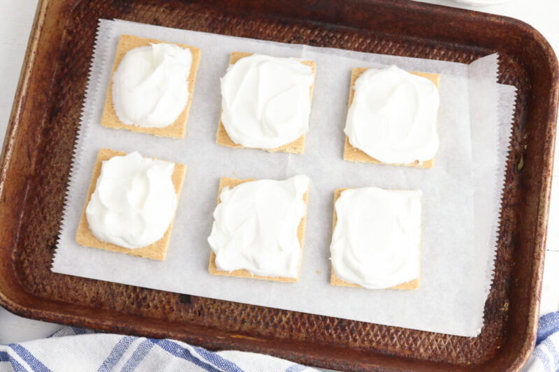 Step 1: Make the baseSpread a thick layer of thawed whipped topping over 6 graham cracker halves.