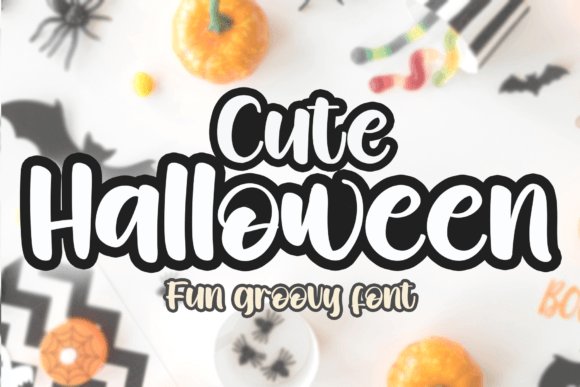 Cute Halloween font in bold black bubble script with white outline, displayed over a blurred background of Halloween decor including pumpkins, bats, and candy.
